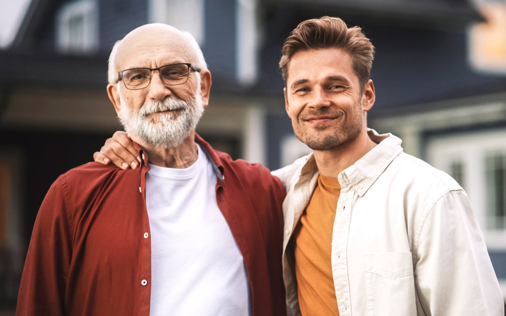 Older man  with glasses and middle age son side by side